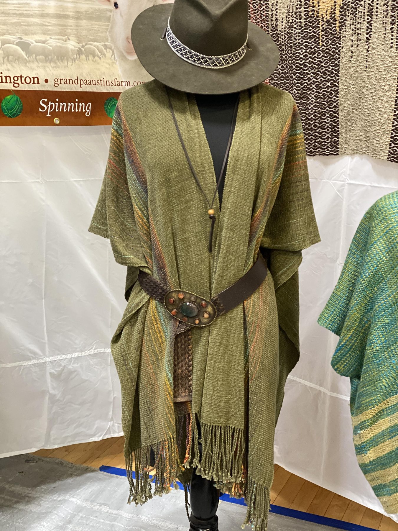 Olive wrap with concho belt laid out at Carol's market booth